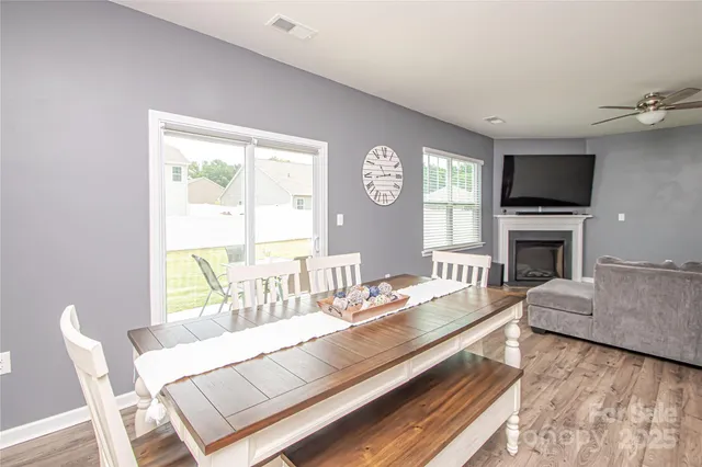 a living room with furniture fireplace and a flat screen tv