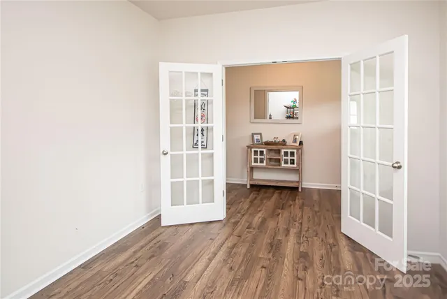 an entryway with wooden floor
