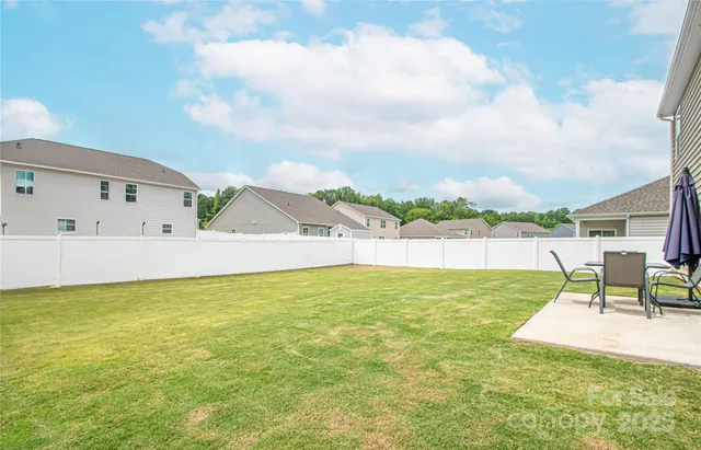 a view of a swimming pool and a yard
