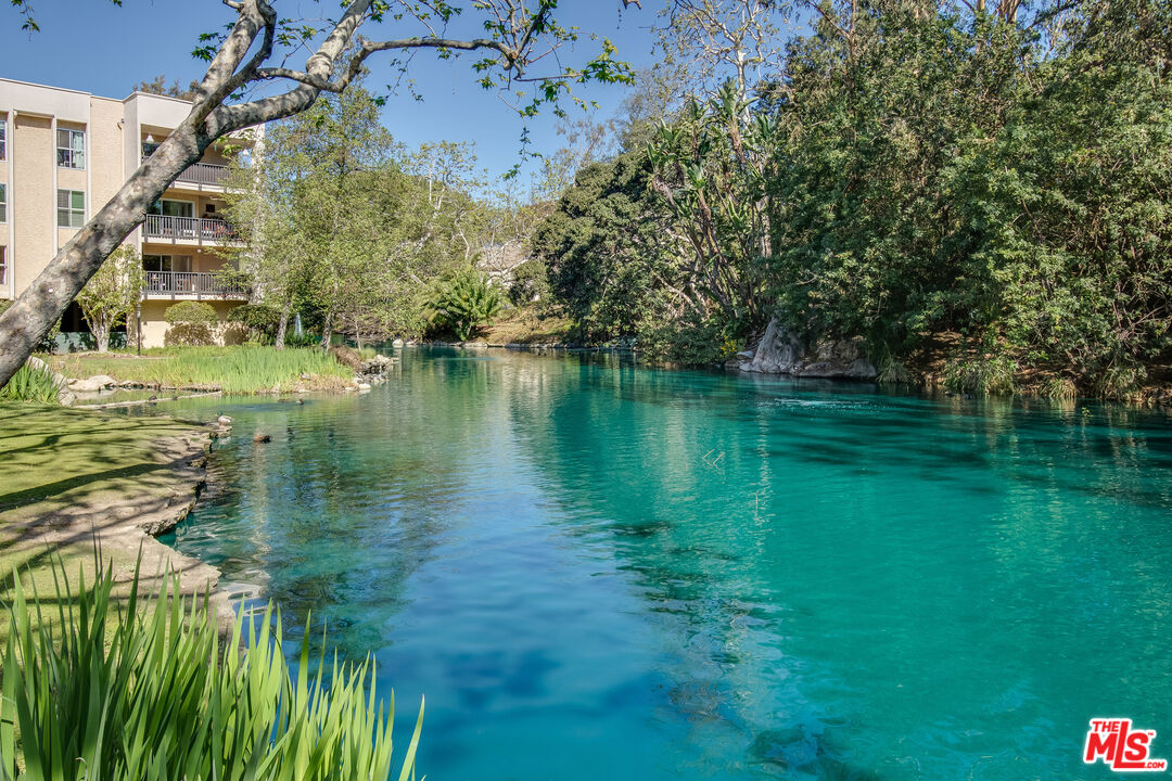 4107 Raintree Circle Culver City, CA 90230 - Photo 17 of 23 a view of a lake with a building in the background