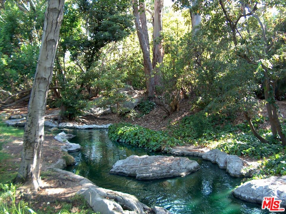 4107 Raintree Circle Culver City, CA 90230 - Photo 4 of 23 a view of a garden with a tree