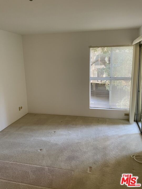 4107 Raintree Circle Culver City, CA 90230 - Photo 7 of 23 a view of a room with a floor to ceiling window and an empty room
