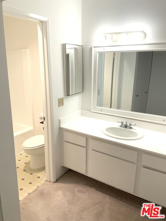 4107 Raintree Circle Culver City, CA 90230 - Photo 9 of 23 a bathroom with a sink and a mirror