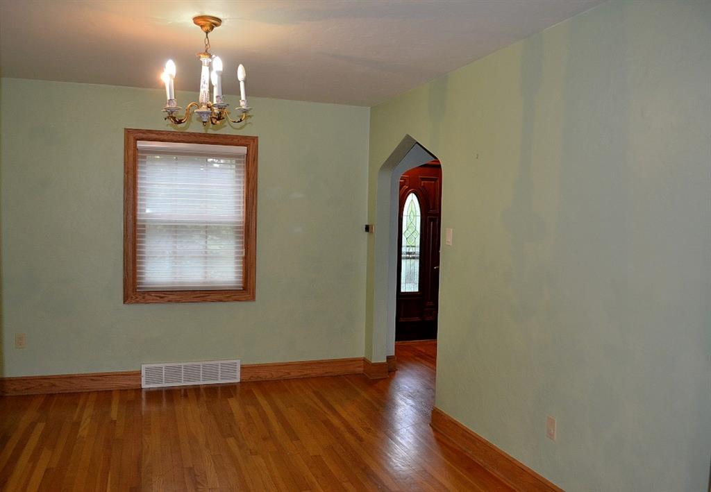 138 Siebert Road Pittsburgh, PA 15237 - Photo 6 of 25 Dining Room: The dining room has beautiful hardwood floors, a chandelier and silhouette shades on the newer multi-paned windows. The dining room, as the living room, is accessed from the front entry.