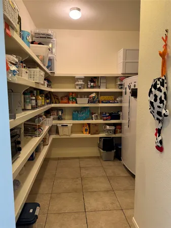 a kitchen with stainless steel appliances a refrigerator and a stove