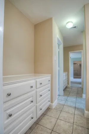 a bathroom with a toilet a sink and a mirror