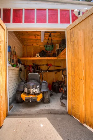 an aerial view of house with yard and mountain view in back