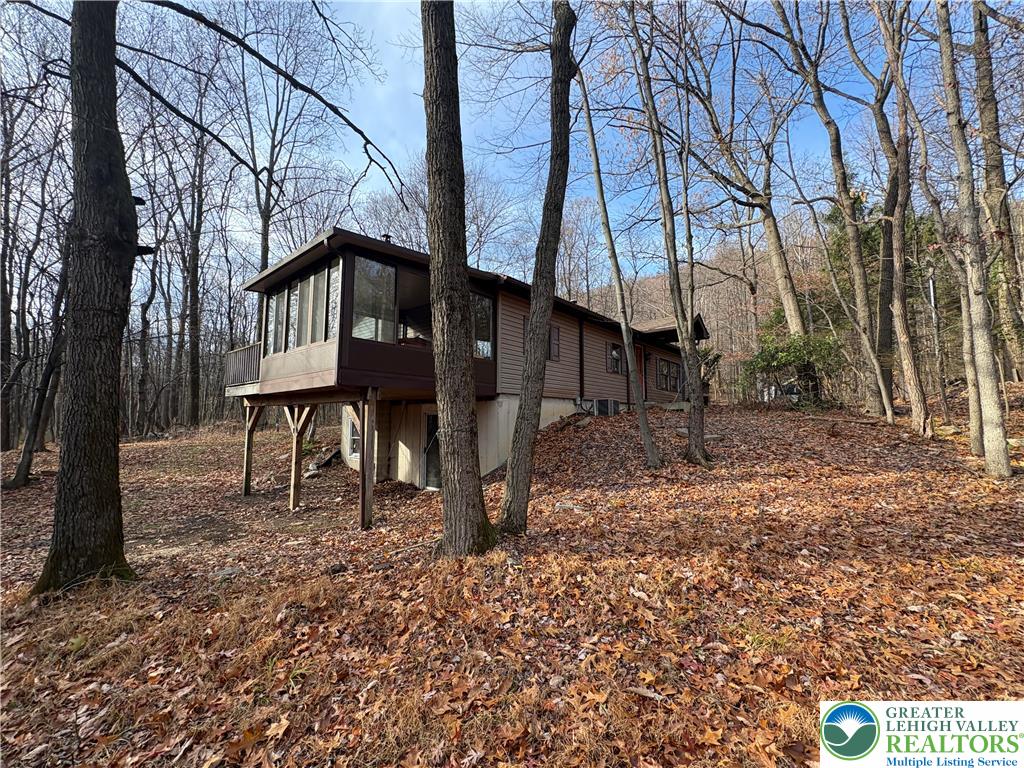 1433 Deer Path Drive Walnutport, PA 18088 - Photo 17 of 39 a house that has a tree in front of the house