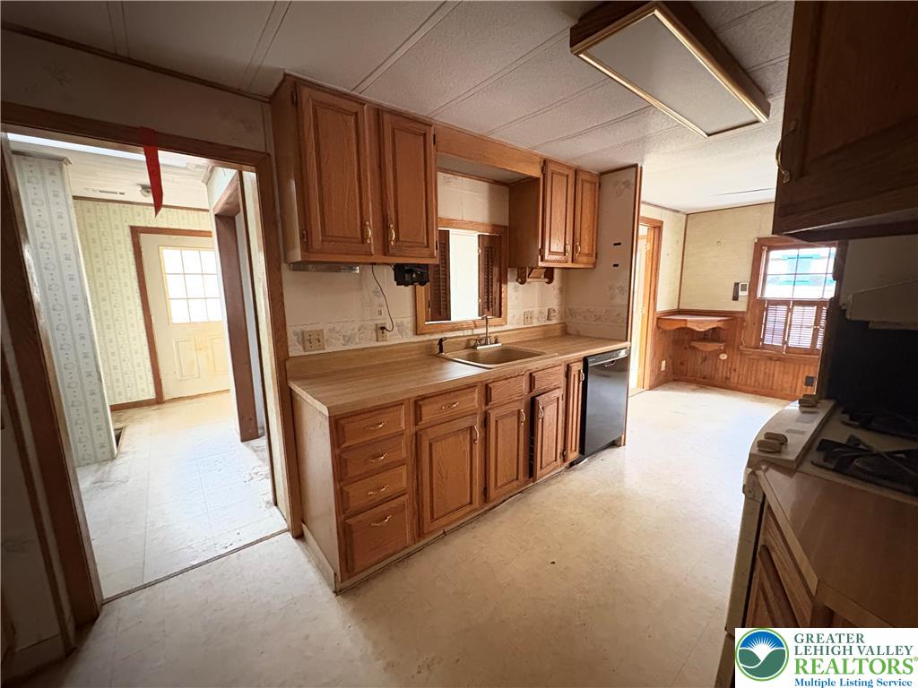 1433 Deer Path Drive Walnutport, PA 18088 - Photo 23 of 39 a kitchen with stainless steel appliances granite countertop a stove a sink dishwasher a refrigerator and a stove with wooden floor