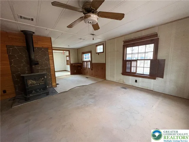 a big room with closet and ceiling fan