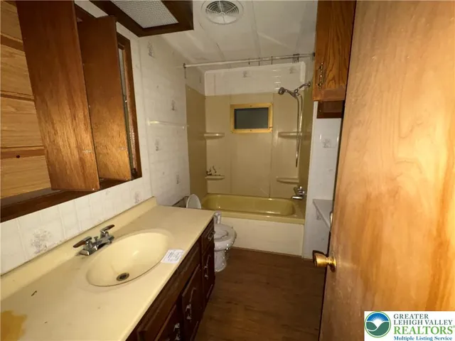 a view of livingroom with furniture wooden floor and window
