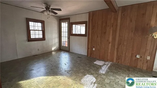 a view of a hallway with wooden shelves
