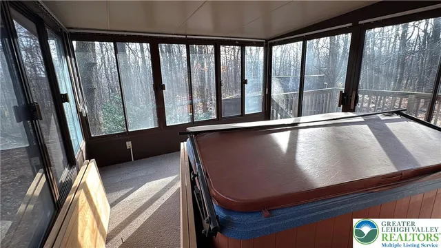 a view of a room with furniture and window