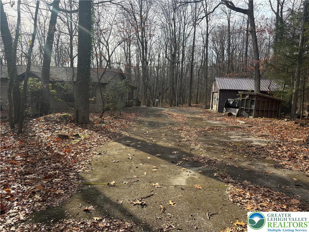 1433 Deer Path Drive Walnutport, PA 18088 - Photo 5 of 39 a backyard of a house with table and chairs