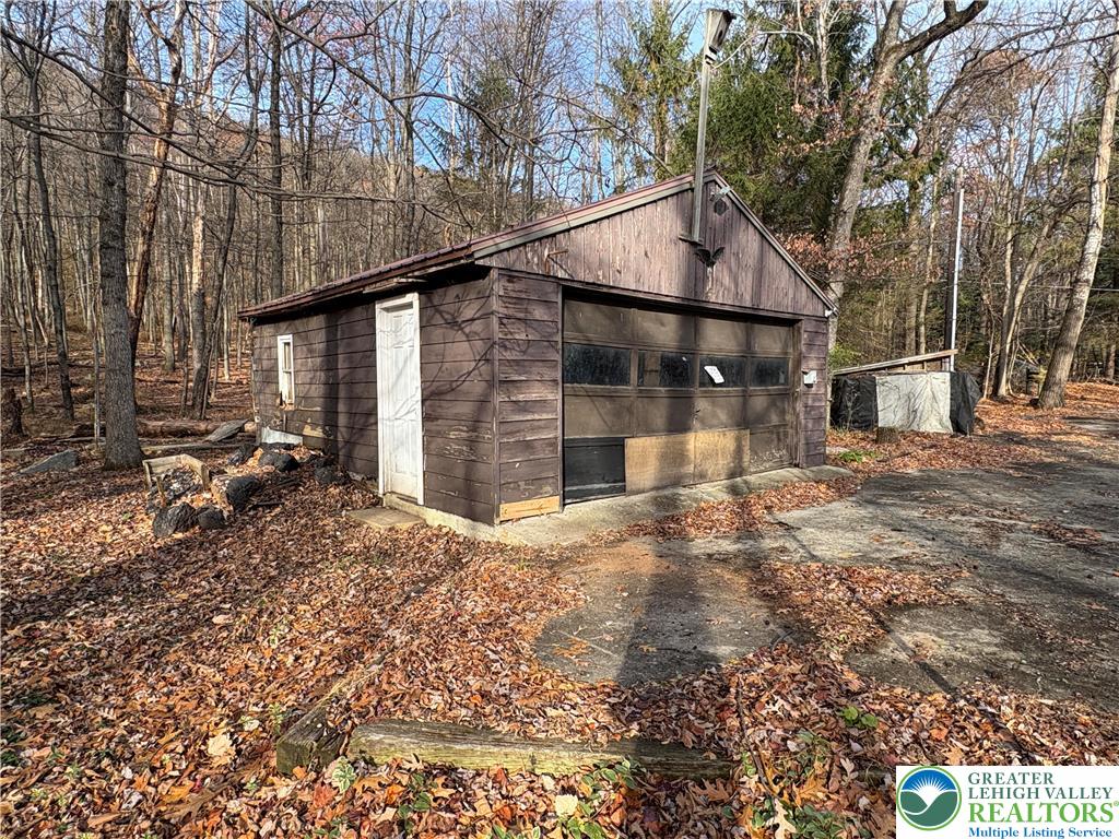 1433 Deer Path Drive Walnutport, PA 18088 - Photo 8 of 39 a backyard of a house with barbeque oven and outdoor seating