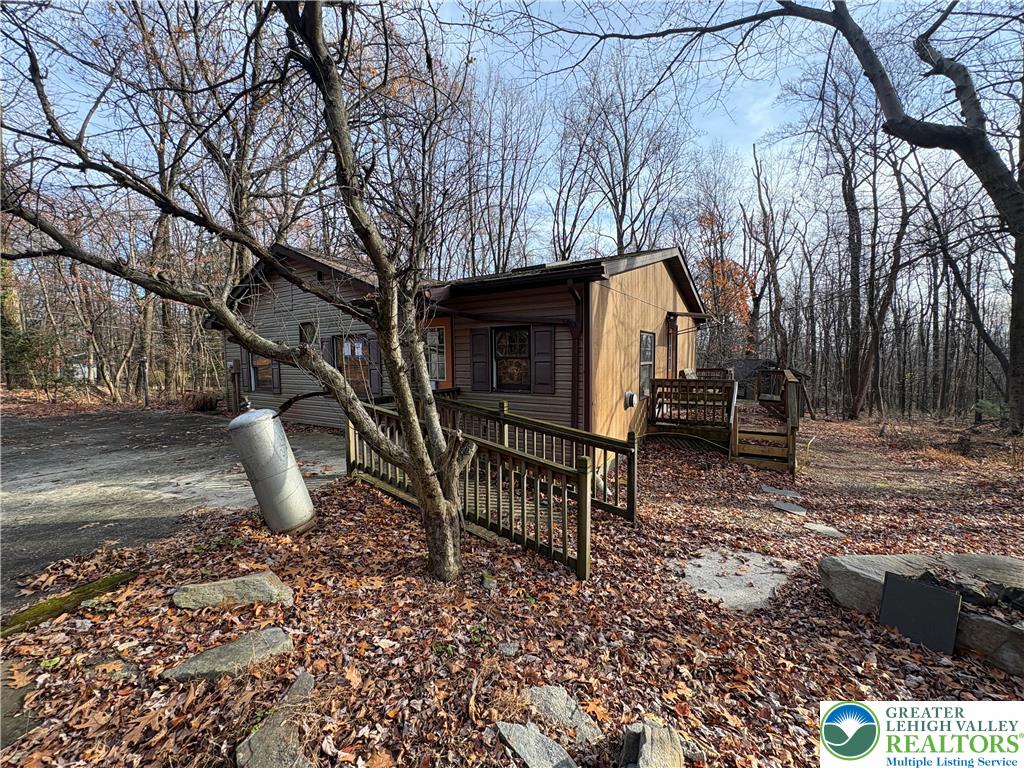 1433 Deer Path Drive Walnutport, PA 18088 - Photo 10 of 39 a backyard of a house with table and chairs
