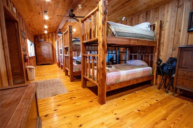 a bedroom with furniture and a rug