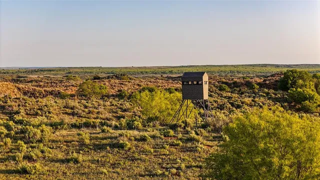 an aerial view of residential building and parking space