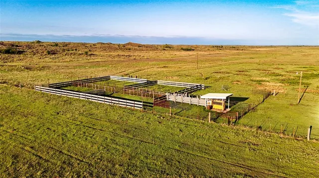 a blue swimming pool is in front of a building