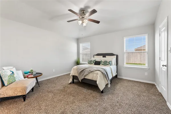 a bedroom with a bed and window