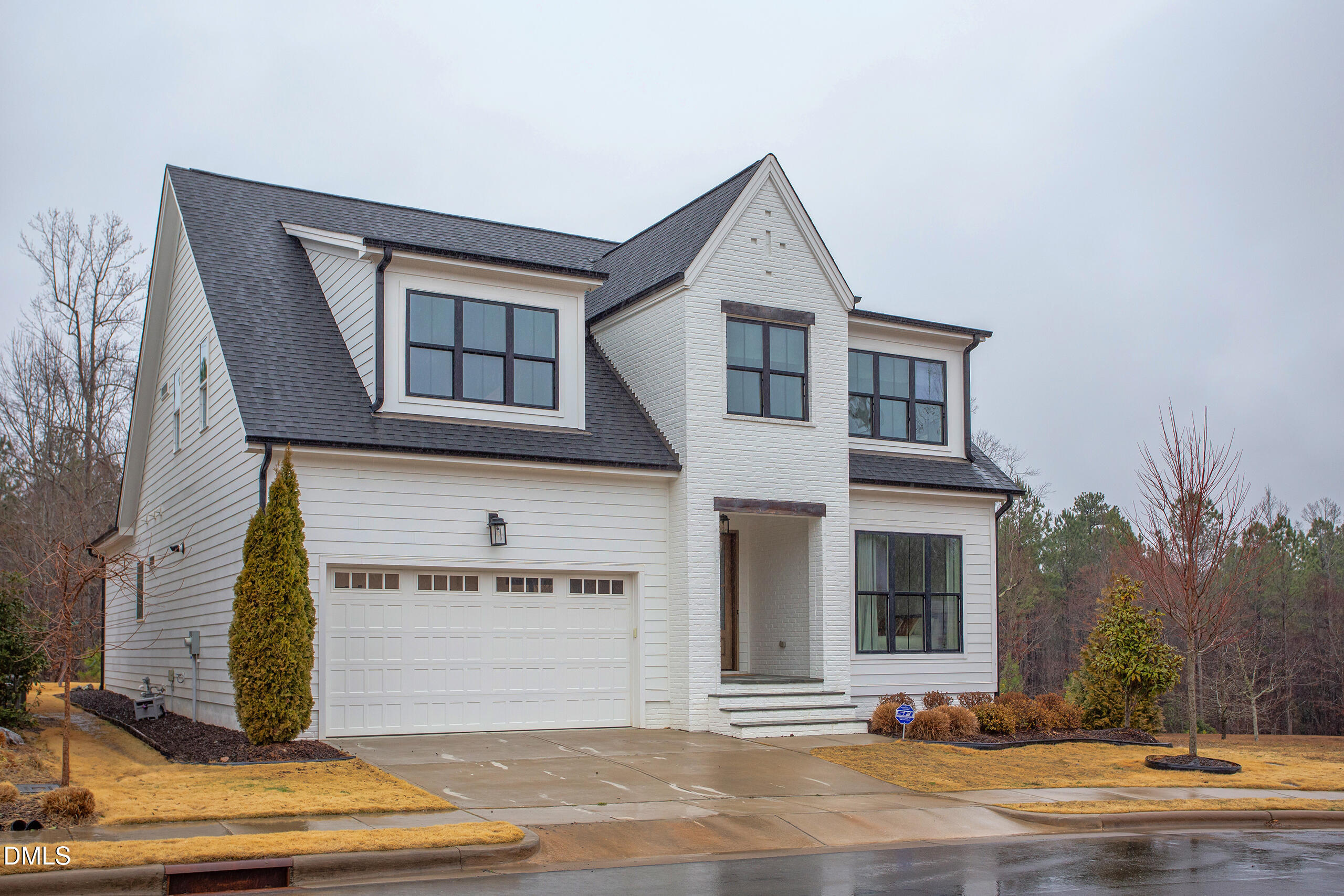 203 Post Oak Road Chapel Hill, NC 27516 - Photo 1 of 52 a front view of a house with a garage