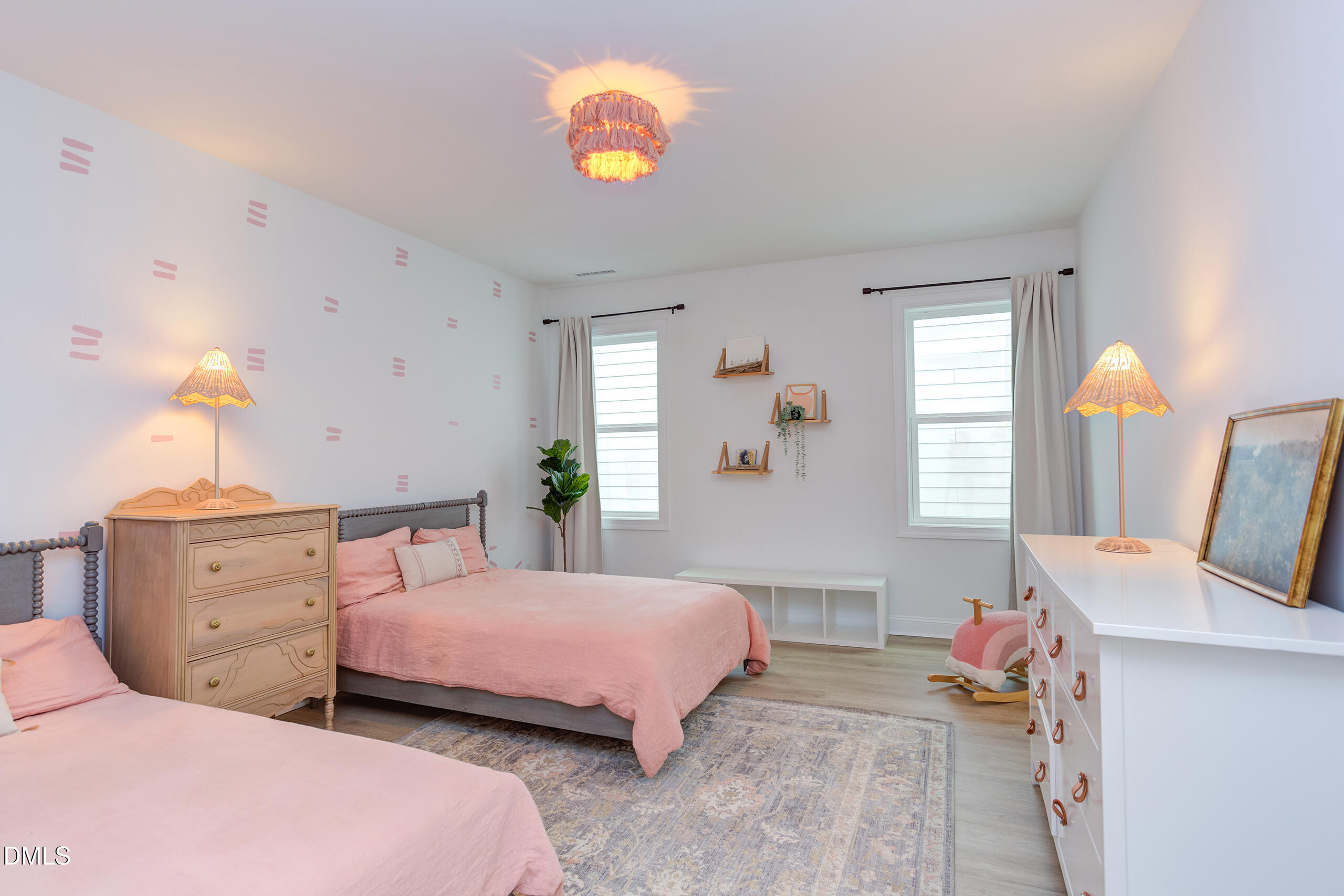 203 Post Oak Road Chapel Hill, NC 27516 - Photo 17 of 52 a bedroom with two beds and a chandelier