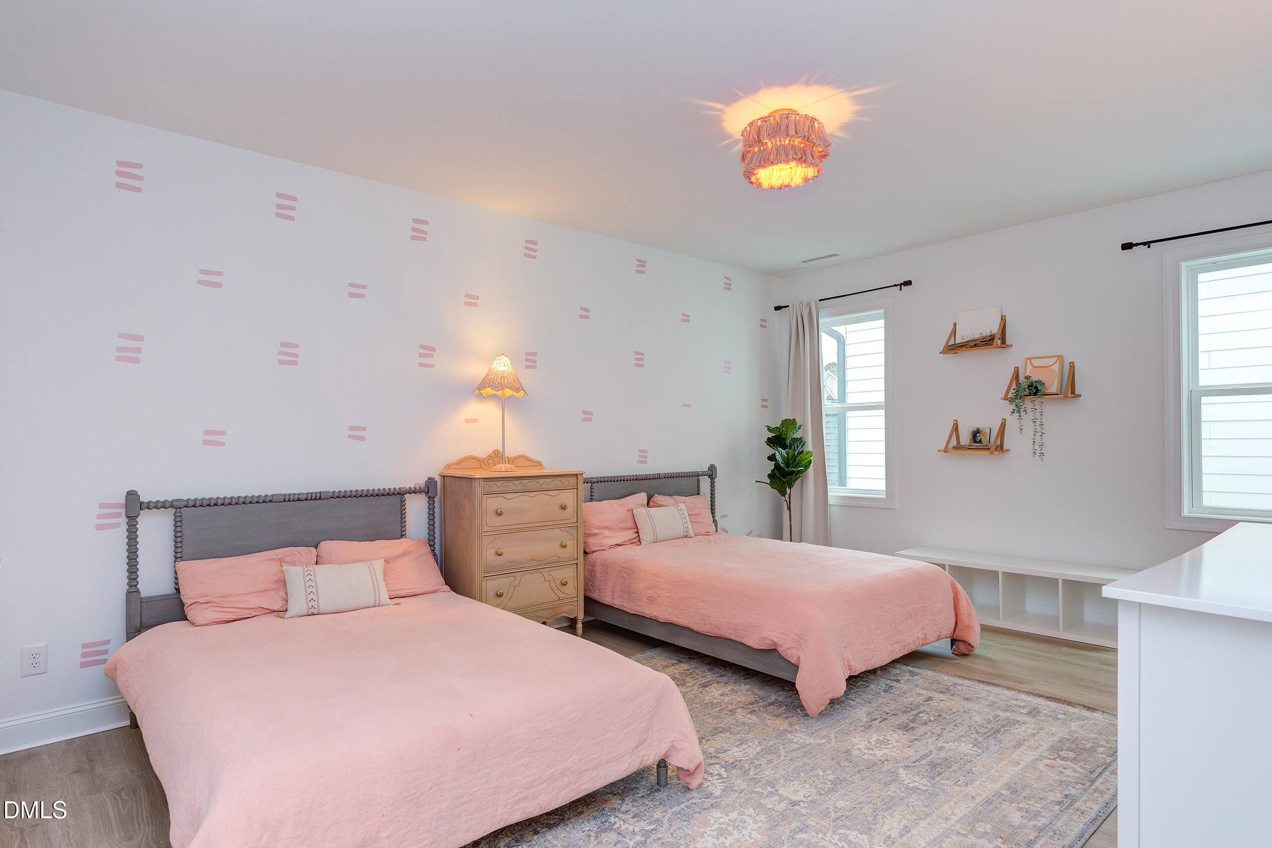 203 Post Oak Road Chapel Hill, NC 27516 - Photo 18 of 52 a bedroom with two beds and potted plant