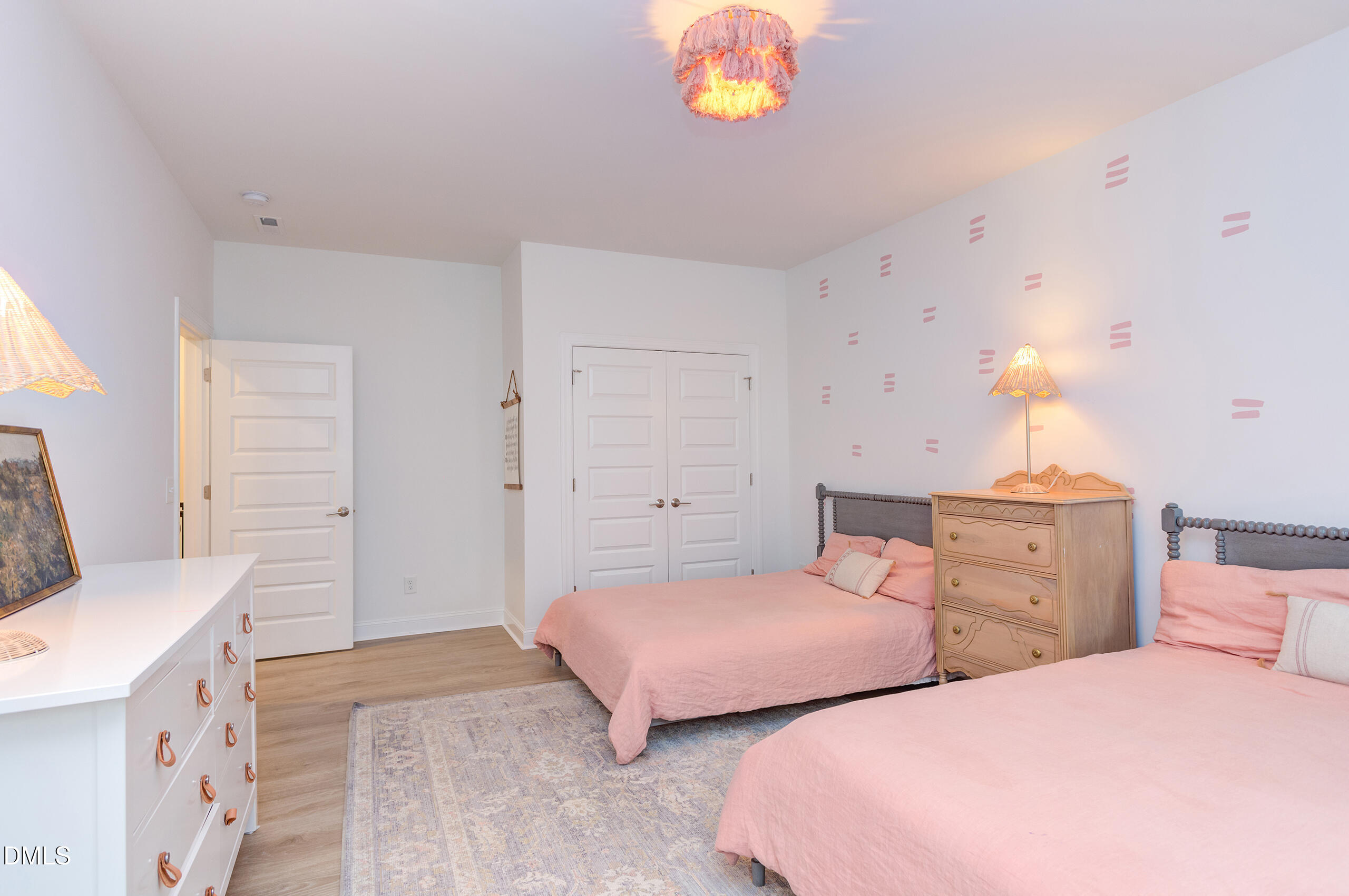 203 Post Oak Road Chapel Hill, NC 27516 - Photo 20 of 52 a bedroom with two beds and a chandelier