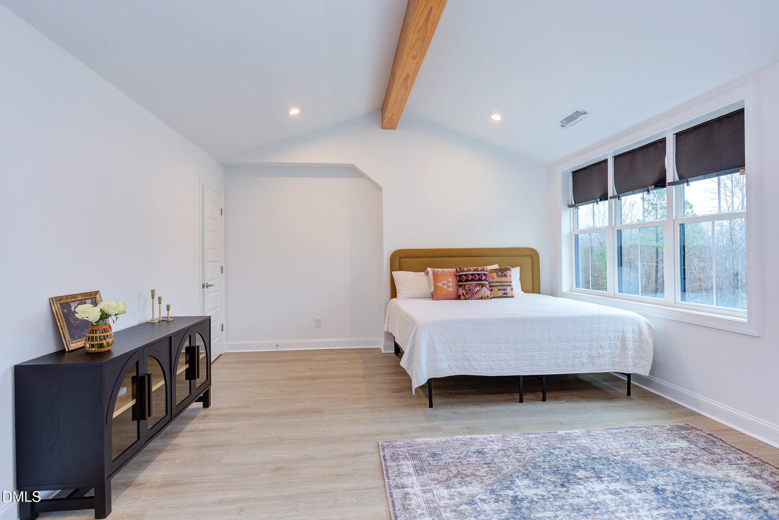 203 Post Oak Road Chapel Hill, NC 27516 - Photo 23 of 52 a bedroom with a bed and a window