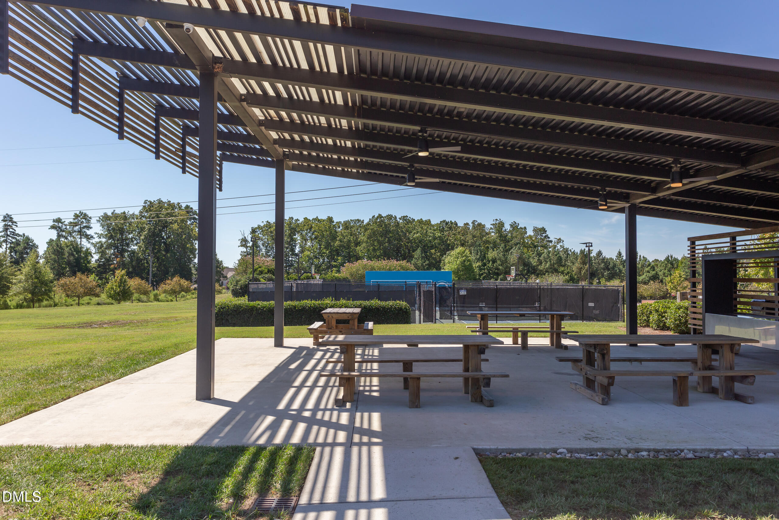 203 Post Oak Road Chapel Hill, NC 27516 - Photo 37 of 52 a view of a patio with table and chairs potted plants with wooden floor and fence