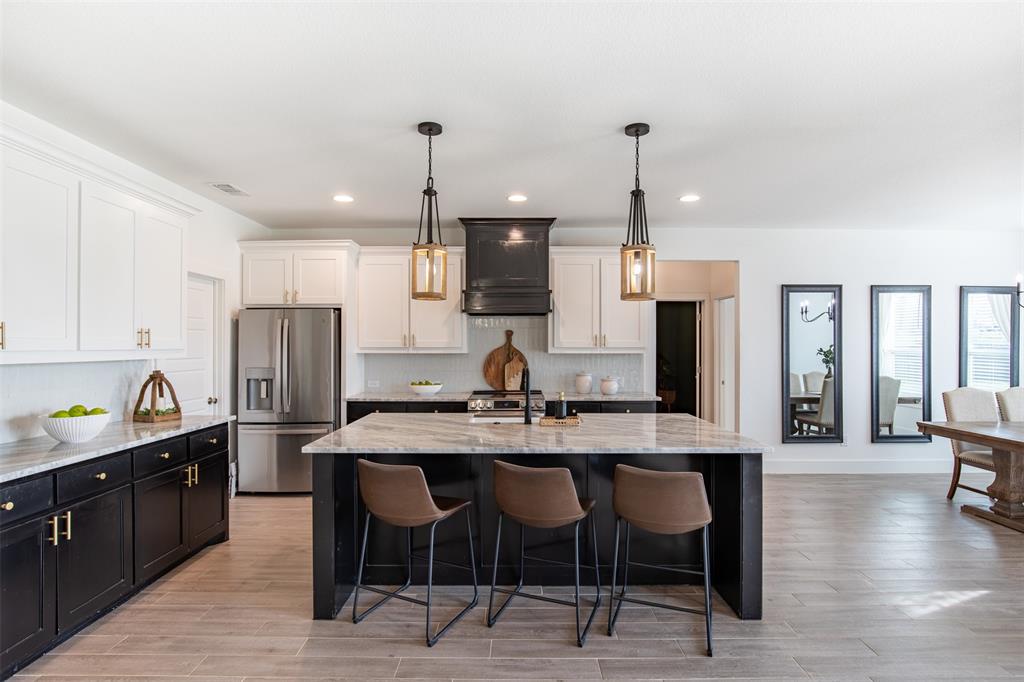 111 Bluegrass Trail Springtown, TX 76082 - Photo 13 of 37 Chef's kitchen features wood cabinetry with luxury hardware.