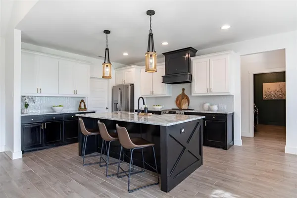 a kitchen with a sink and stove