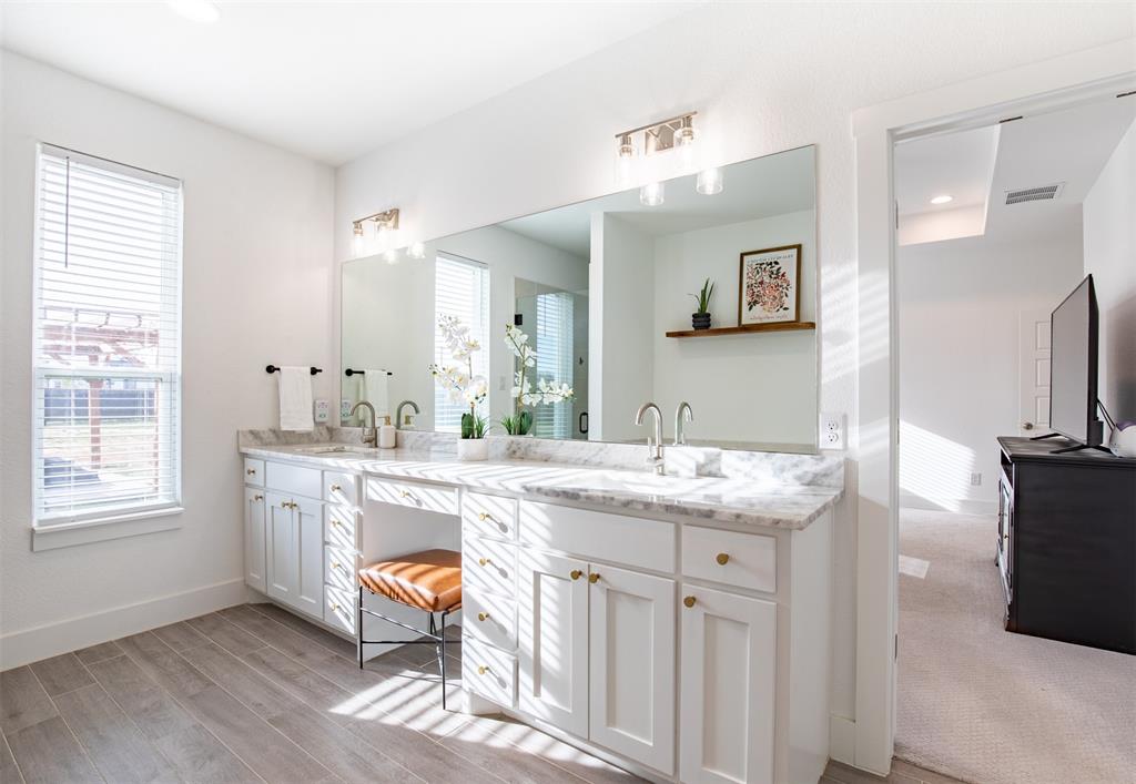 111 Bluegrass Trail Springtown, TX 76082 - Photo 23 of 37 En-suite bath with dual sinks and vanity sitting area.