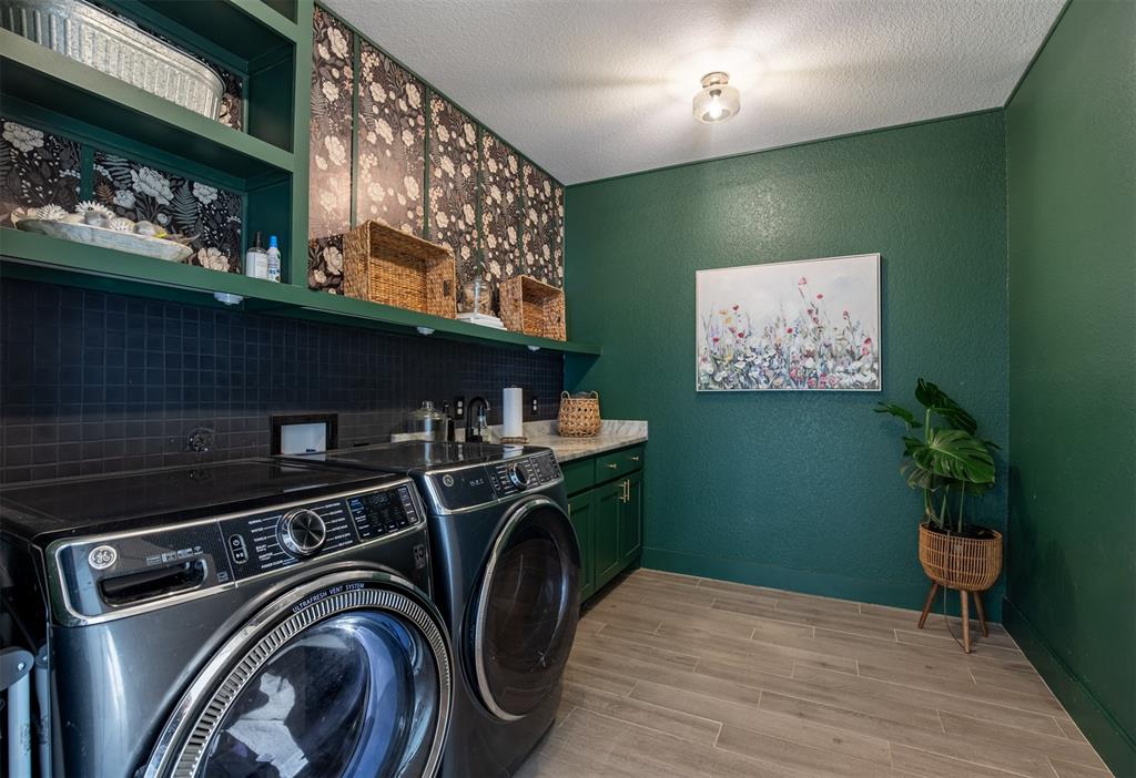 111 Bluegrass Trail Springtown, TX 76082 - Photo 26 of 37 Oversized laundry room with sink, built-in cabinetry, and shelving.