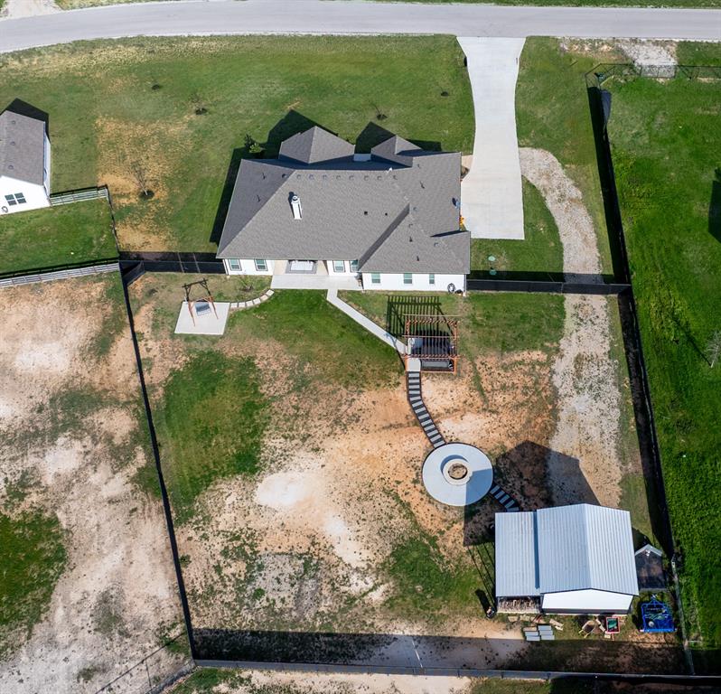 111 Bluegrass Trail Springtown, TX 76082 - Photo 37 of 37 Aerial view of back of home showcasing backyard.