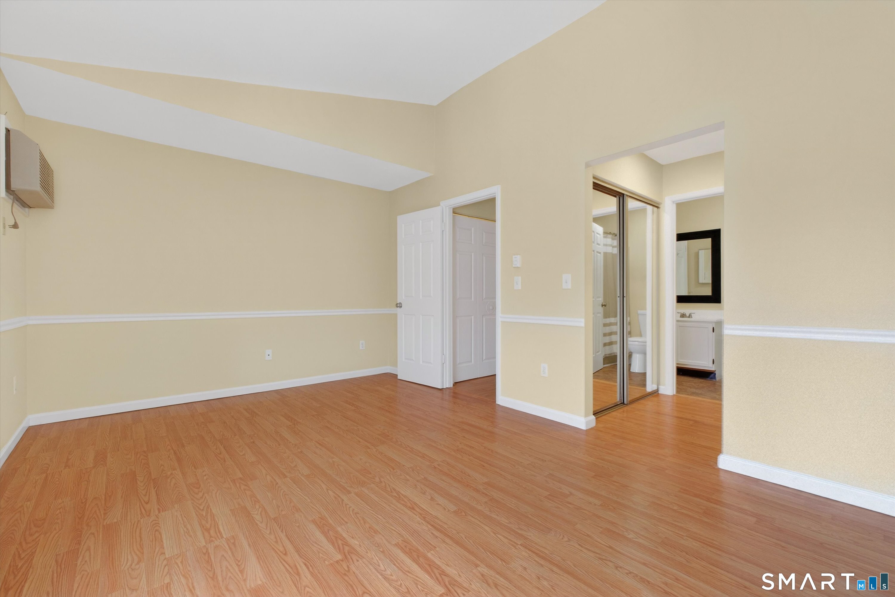 20 East Pembroke Road, Unit 8 Danbury, CT 06811 - Photo 13 of 23 a view of a big room with wooden floor and windows