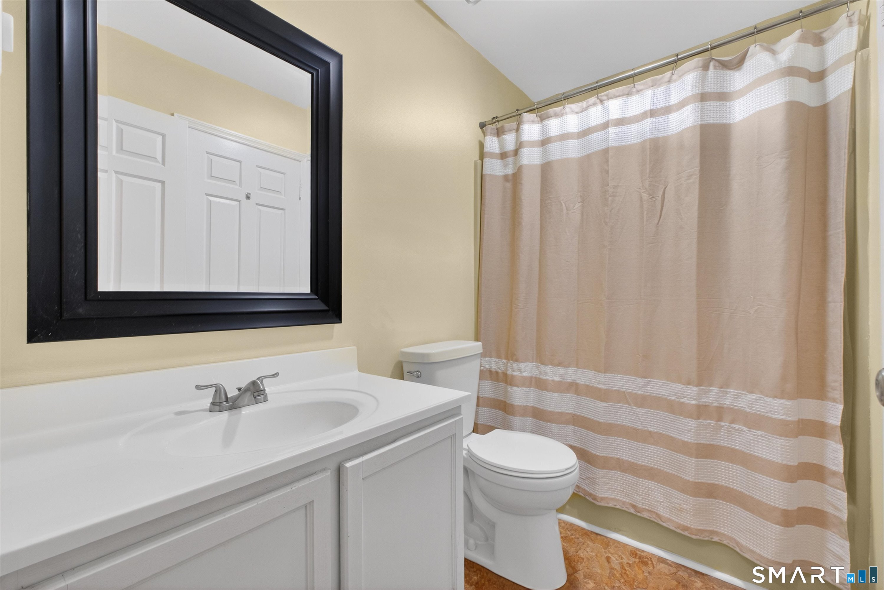20 East Pembroke Road, Unit 8 Danbury, CT 06811 - Photo 18 of 23 a bathroom with a sink and a mirror