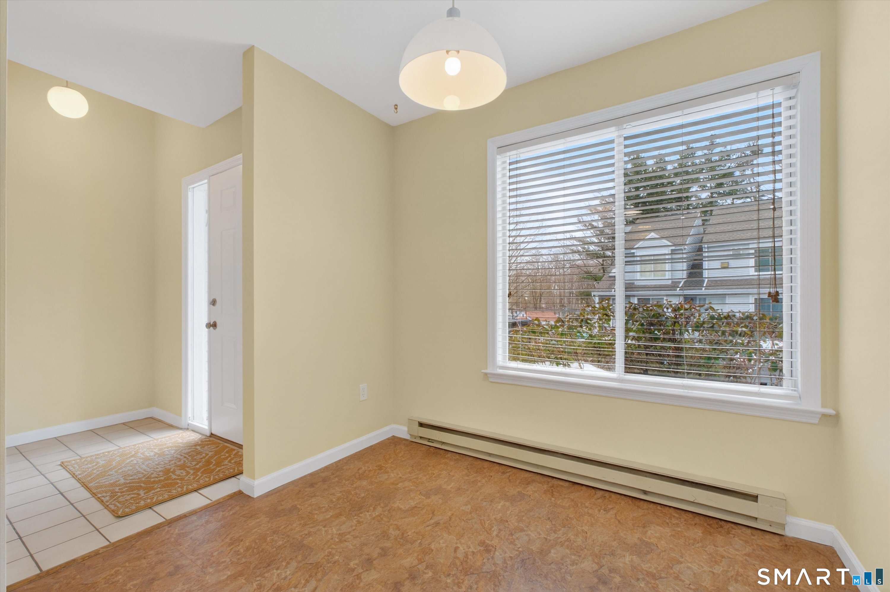 20 East Pembroke Road, Unit 8 Danbury, CT 06811 - Photo 5 of 23 a view of an empty room with a window