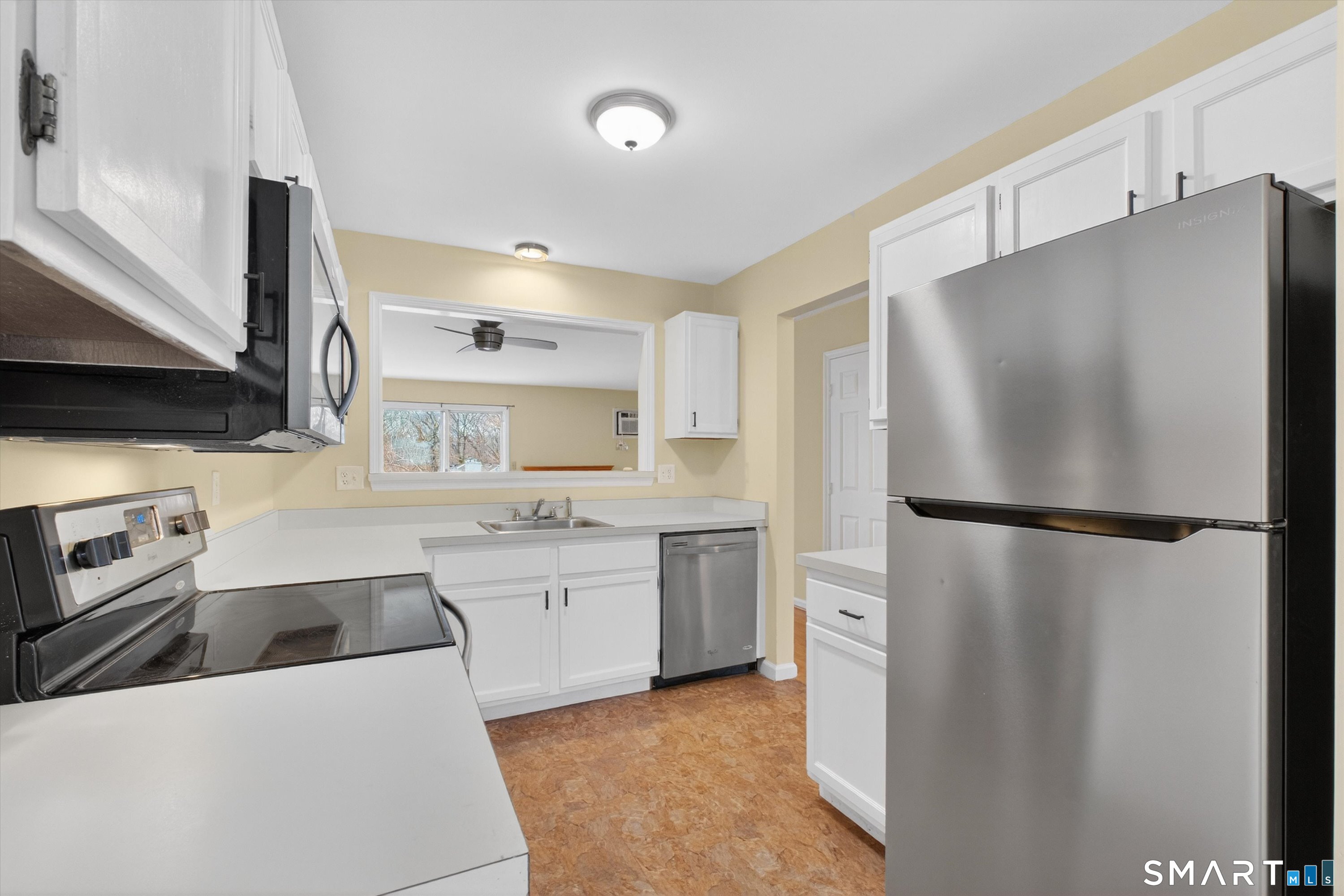 20 East Pembroke Road, Unit 8 Danbury, CT 06811 - Photo 7 of 23 a kitchen with a refrigerator sink and stove