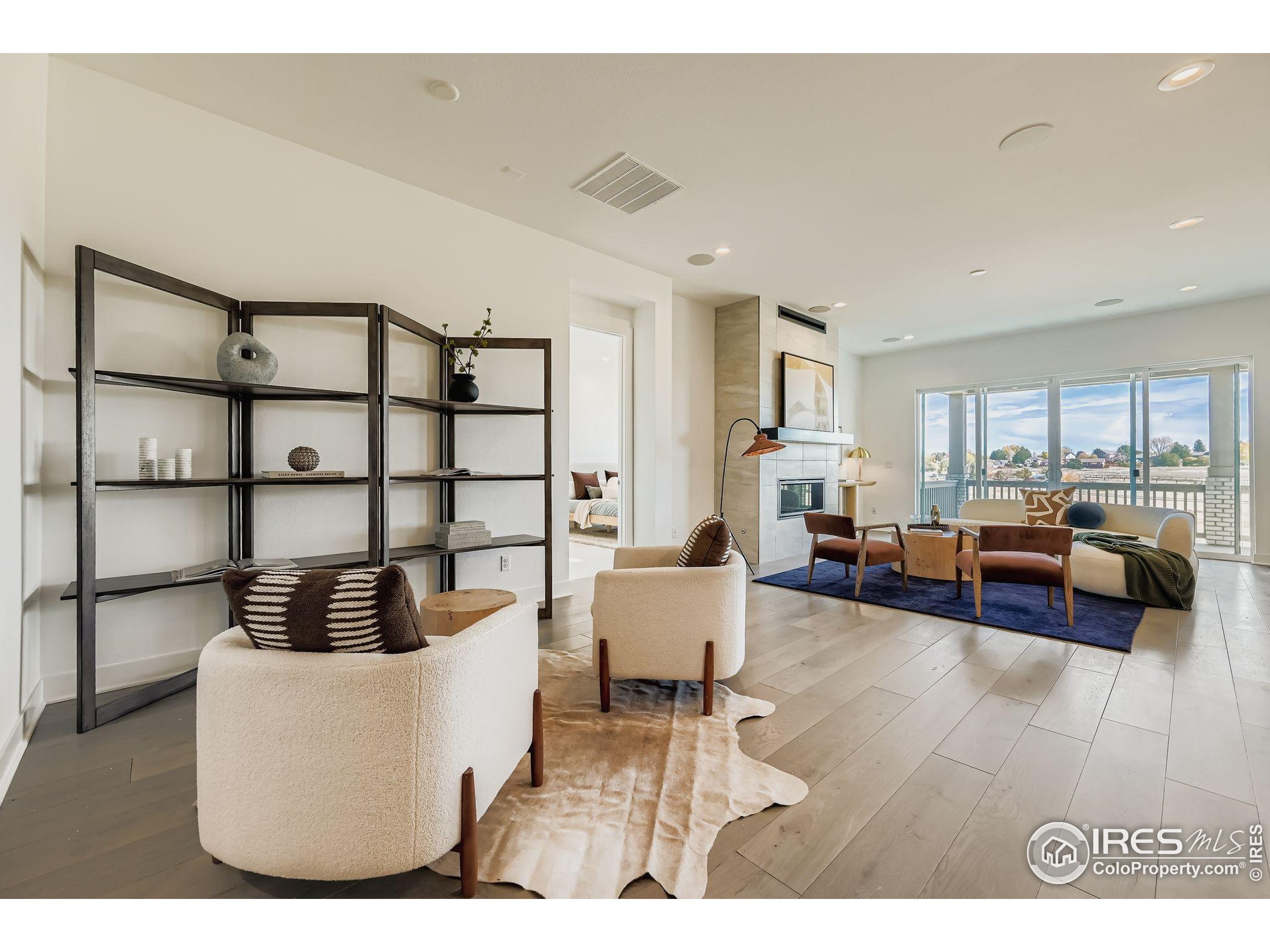 3100 Newfound Lk Road Berthoud, CO 80513 - Photo 2 of 21 a living room with furniture and a book shelf