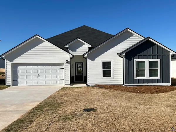 a front view of a house with a garage
