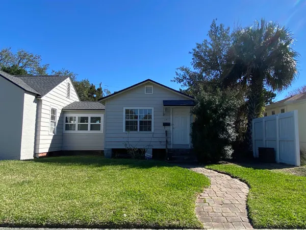 a view of a house with a backyard