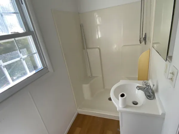 a bathroom with a sink and a window