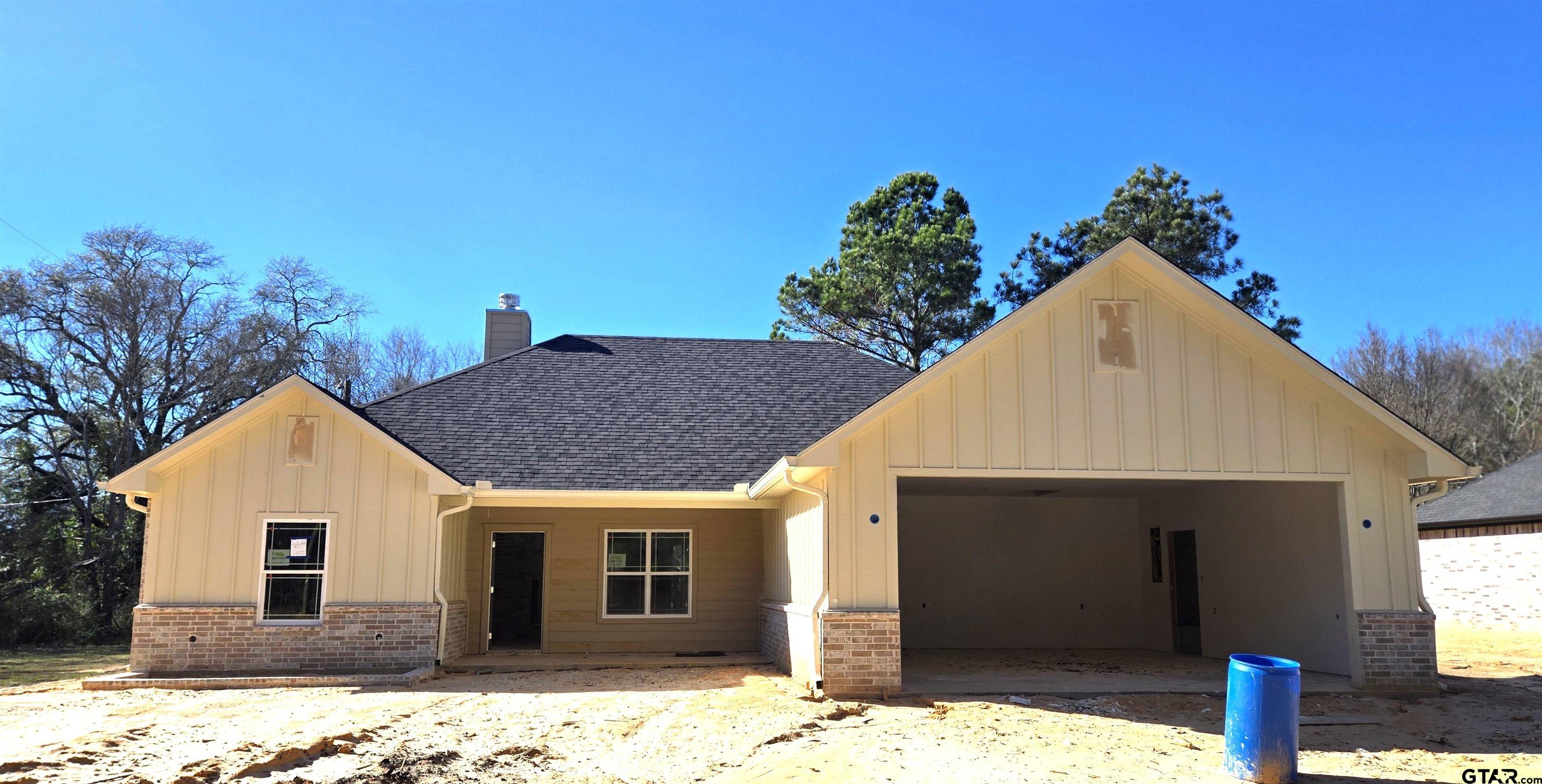 a view of house with yard