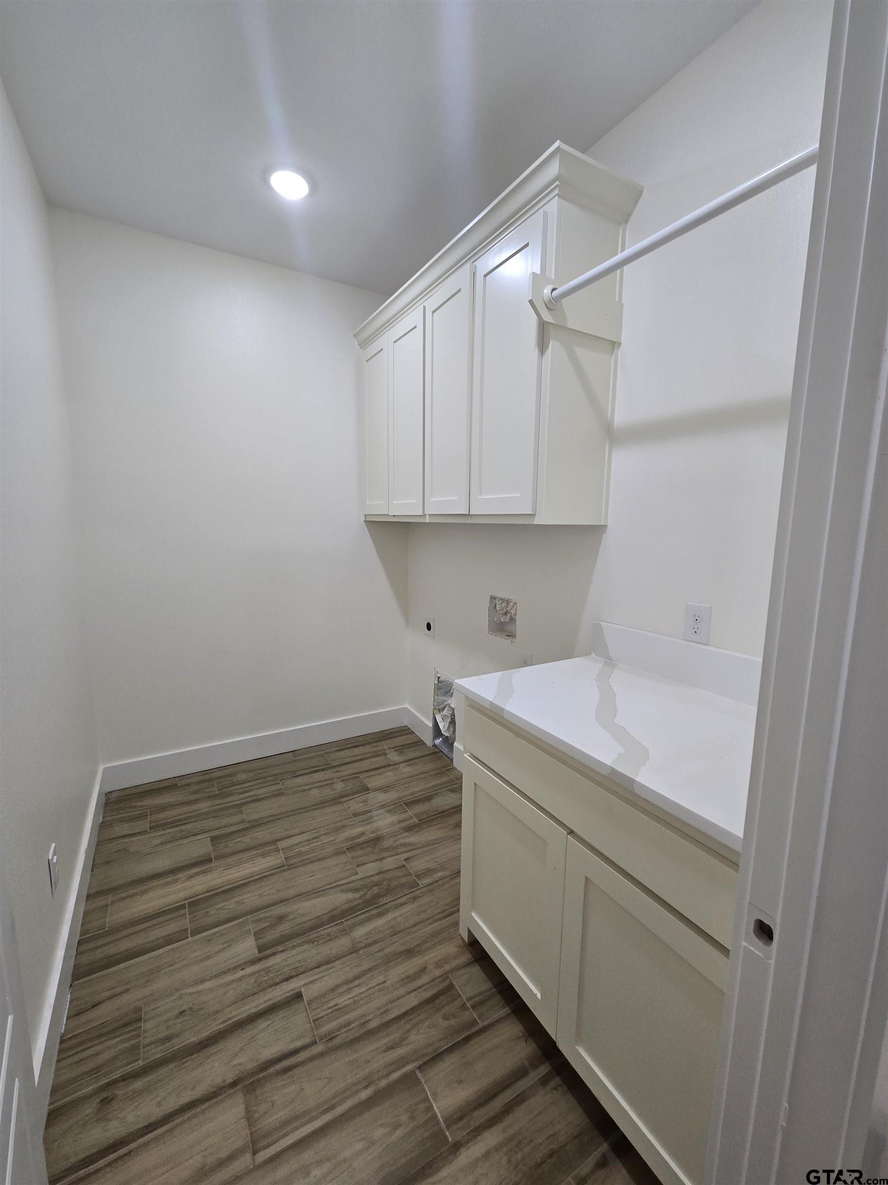 7227 Cr 485 Tyler Tx 75706 Tyler, TX 75706 - Photo 13 of 23 a view of storage and utility room with wooden floor