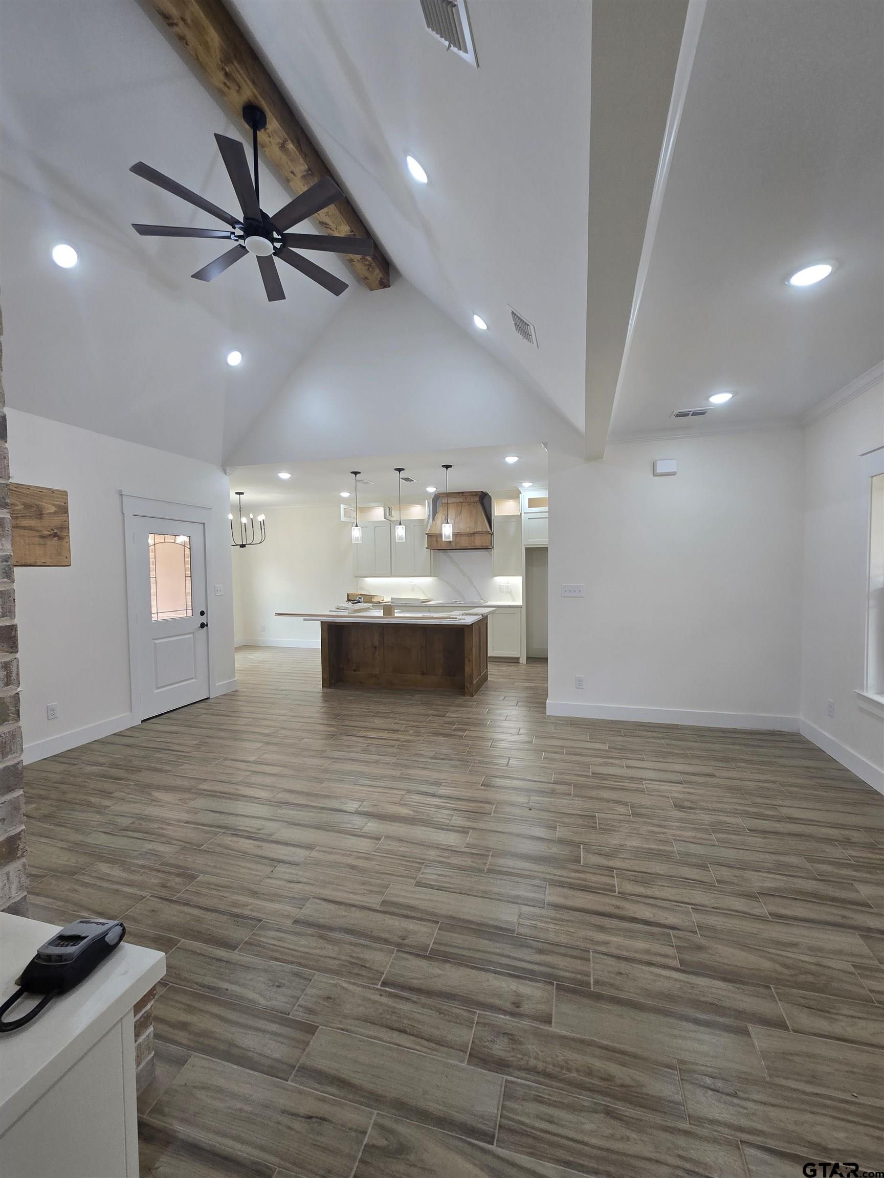 7227 Cr 485 Tyler Tx 75706 Tyler, TX 75706 - Photo 2 of 23 a view of a room with kitchen island and stainless steel appliances