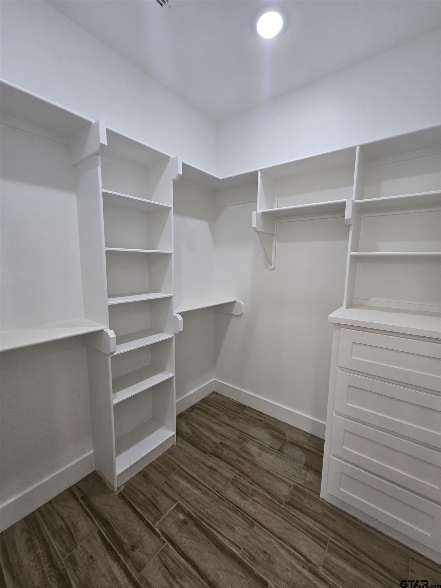 7227 Cr 485 Tyler Tx 75706 Tyler, TX 75706 - Photo 21 of 23 a view of walk in closet with empty racks