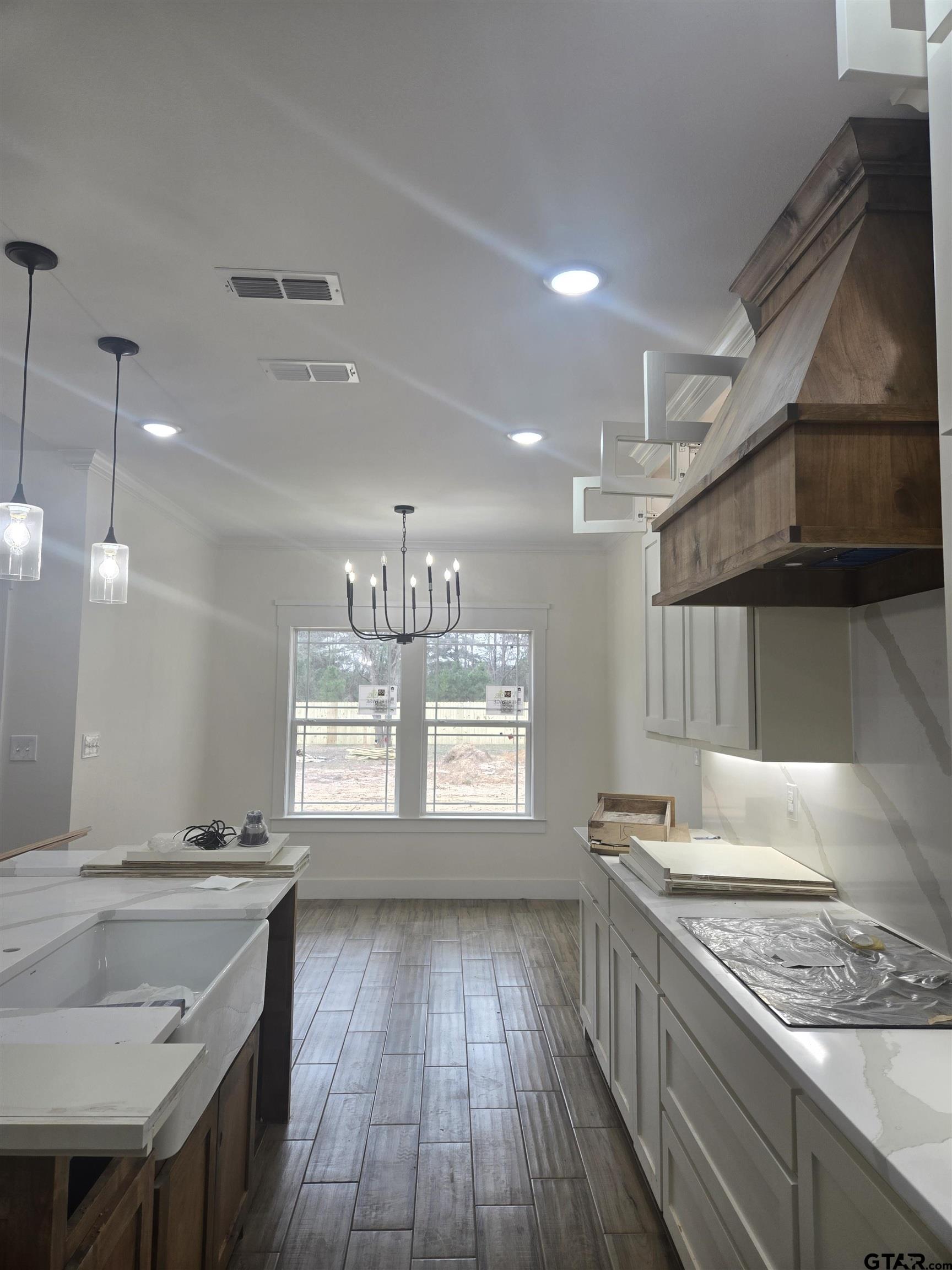 7227 Cr 485 Tyler Tx 75706 Tyler, TX 75706 - Photo 3 of 23 a kitchen with granite countertop a stove and a sink
