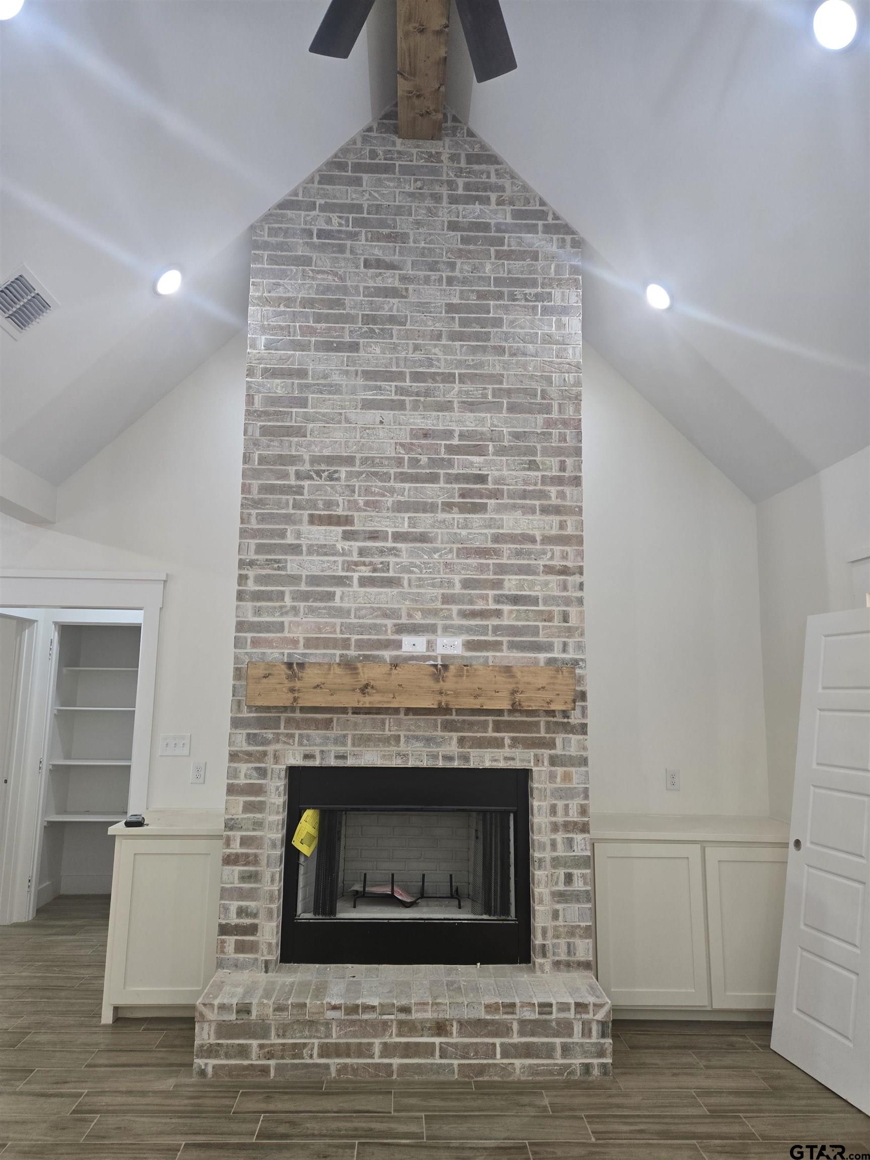 7227 Cr 485 Tyler Tx 75706 Tyler, TX 75706 - Photo 7 of 23 a living room with a fireplace