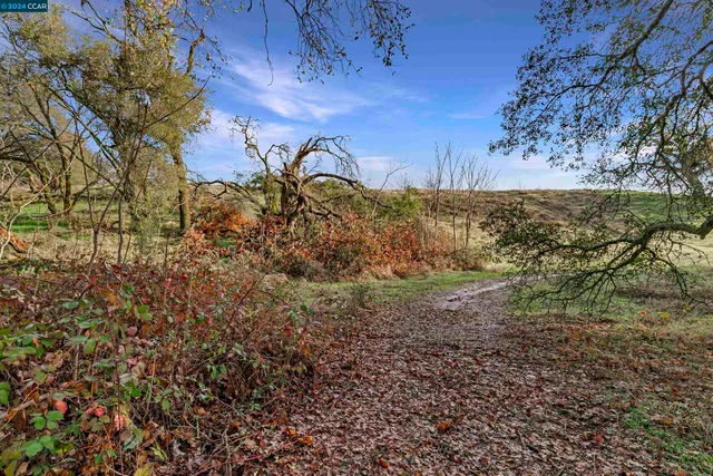 a view of mountain with sunset